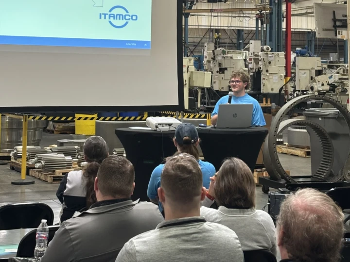 ITAMCO intern Owen Waymouth shares his presentation with the audience